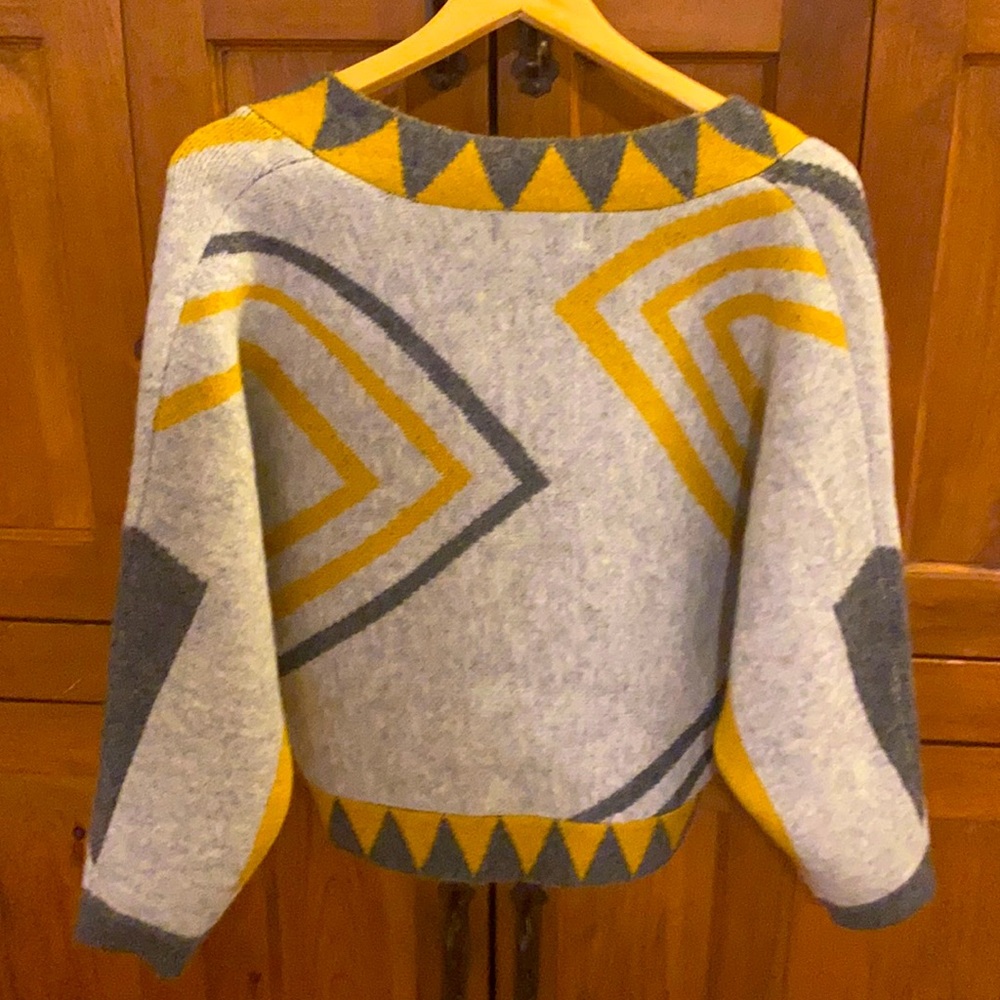 Super cute. Can wear as jacket, accent piece, dress up or dress down. As new